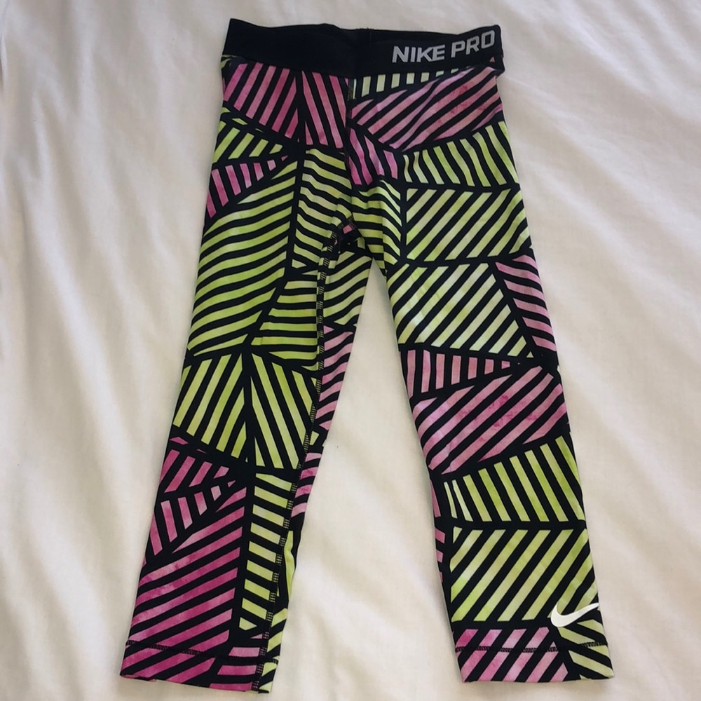 pink and yellow nike capris